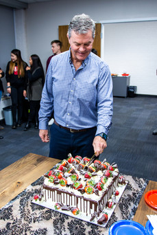 Man cutting a cake