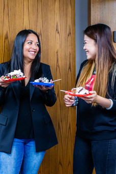 Two women with cake slices